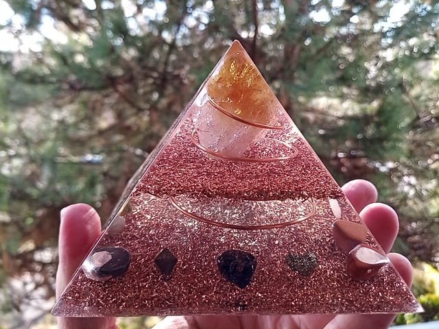 Abundance orgone pyramid generator with a citrine crystal at the top.