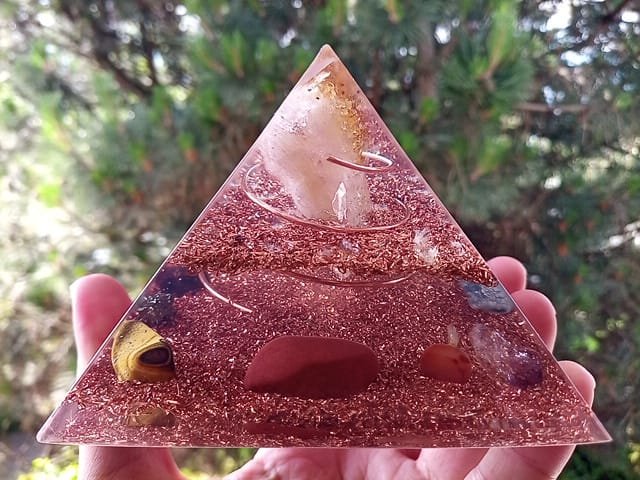 Abundance orgone pyramid made of clear resin and copper