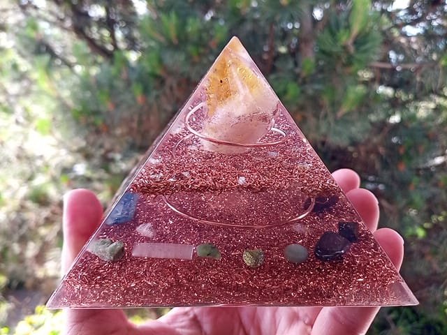 Abundance orgone pyramid with jade, peridot and green aventurine crystals with pine tree