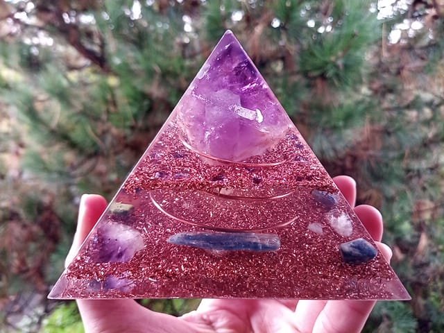 Amethyst orgone pyramid with large amethyst point at the top