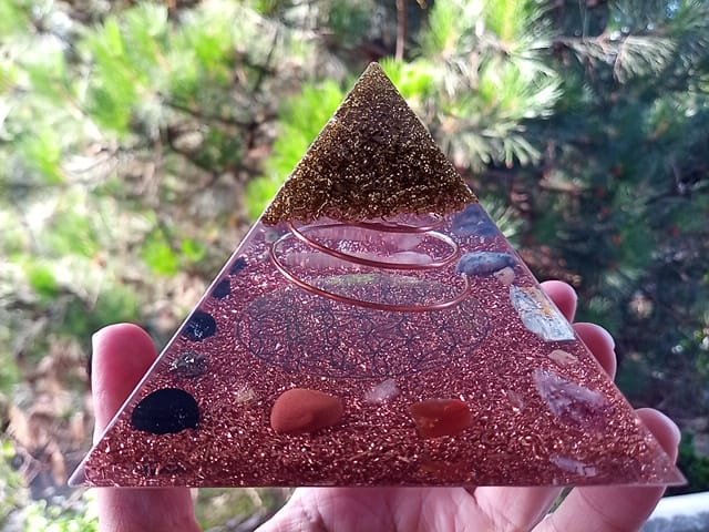 Flower of Life orgonite pyramid with flower of life symbol in the center.