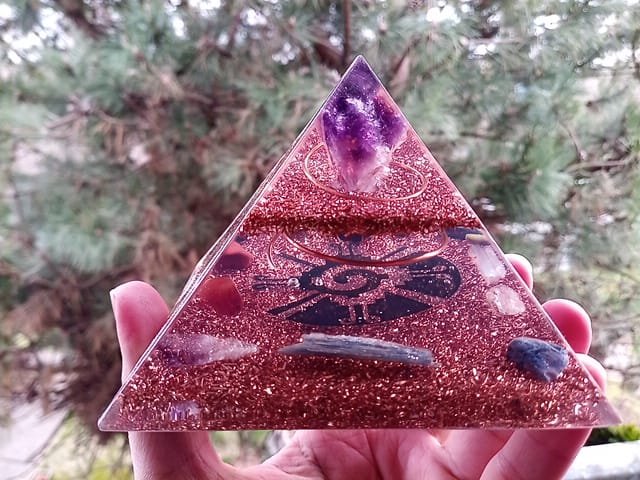 Galactic Butterfly orgone pyramid generator with blue kyanite clearing crystal.