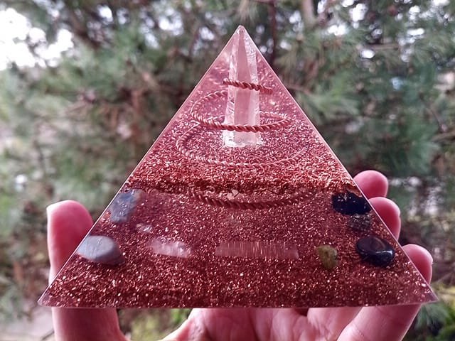 Lemurian Seed Crystal orgone pyramid with selenite and rose quartz crystals.