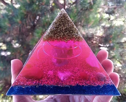 St. Germain orgone pyramid with large amethyst crystal in the center.