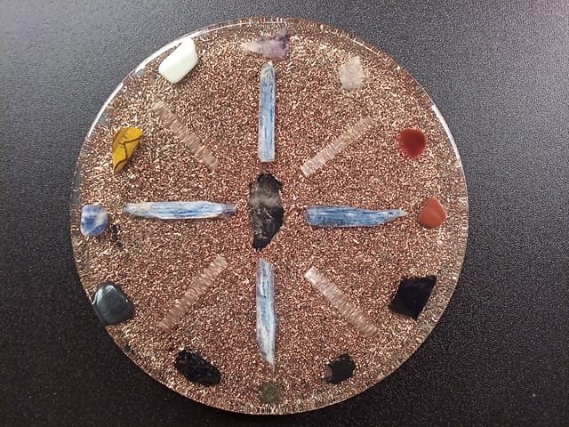 Clear orgone plate with black tourmaline and shungite crystals.