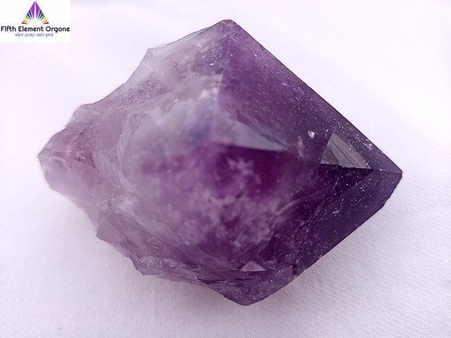 Amethyst point crystal on a white background