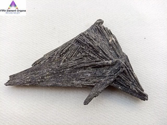 Black Kyanite crystal on a white background