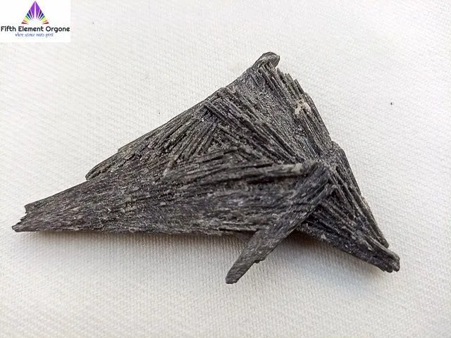 Black Kyanite crystal on a white background