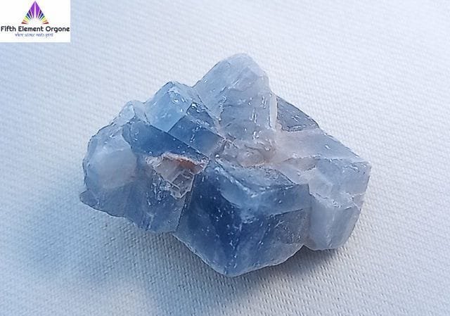 Blue Calcite crystal on a white background