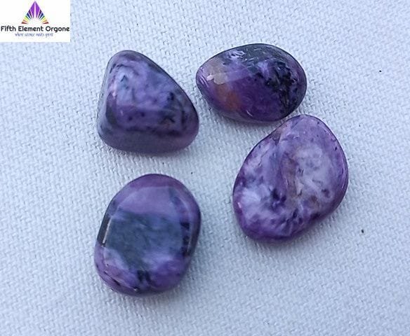 Charoite crystals on a white background