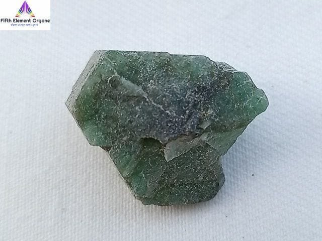 Emerald crystal on a white background
