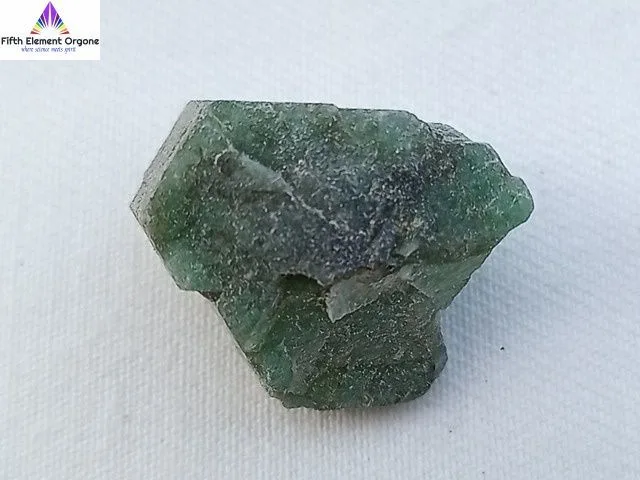 Emerald crystal on a white background