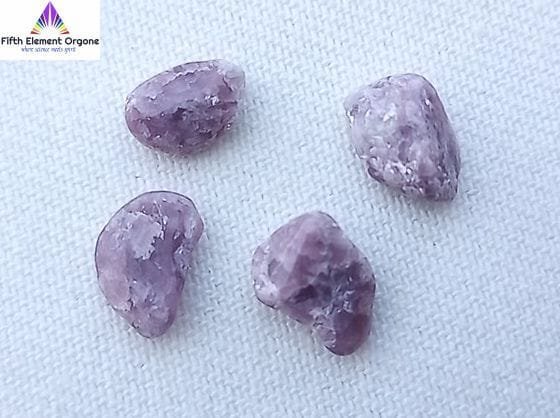 Lepidolite crystals on a white background.